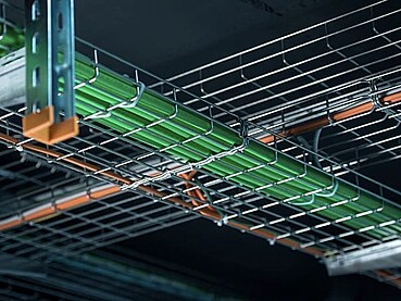 Wire Mesh Cable Trays for Data Center Hot Aisle Containment in the UAE: Engineering Airflow Control and Load Stability